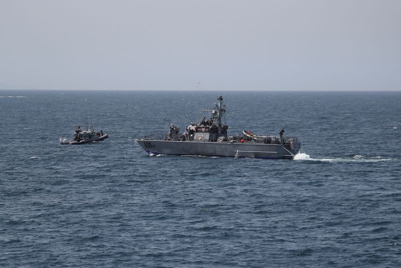 FILE PHOTO: Israeli navy boats are seen in the Mediterranean Sea as seen from Rosh Hanikra, close to the Lebanese border, northern Israel May 4, 2021.