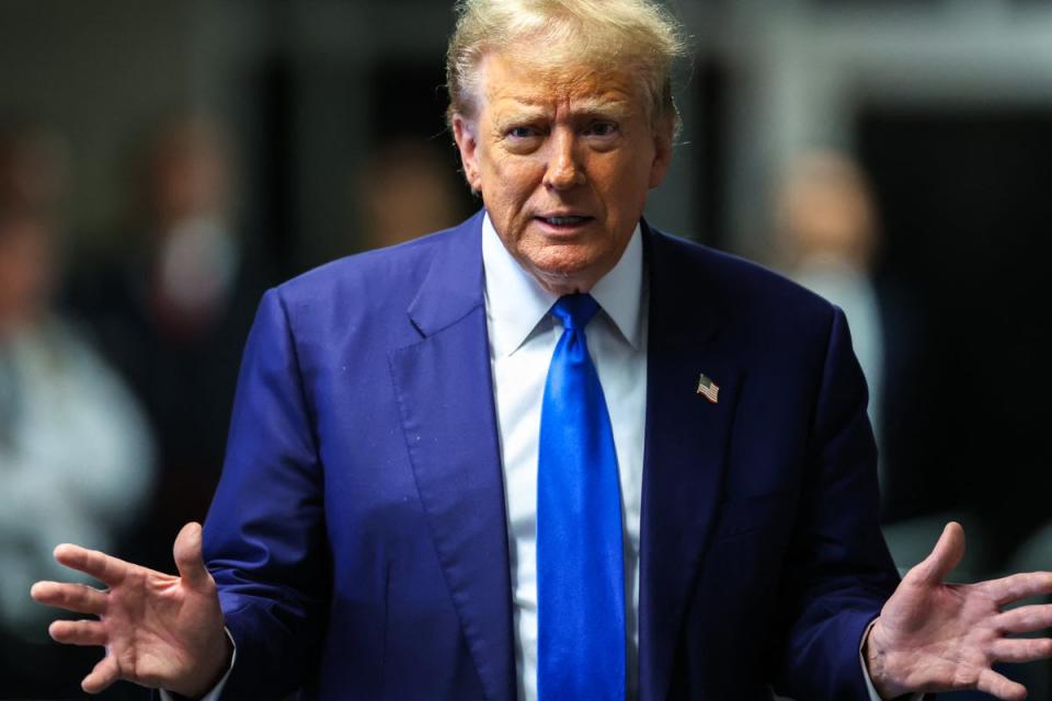 Donald Trump speaks to reporters inside a criminal courthouse in Manhattan on 3 May. (POOL/AFP via Getty Images)