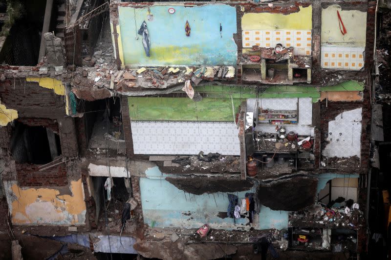 Damaged rooms of a building are seen after a portion of a three-storey residential building collapsed in Bhiwandi on the outskirts of Mumbai, India
