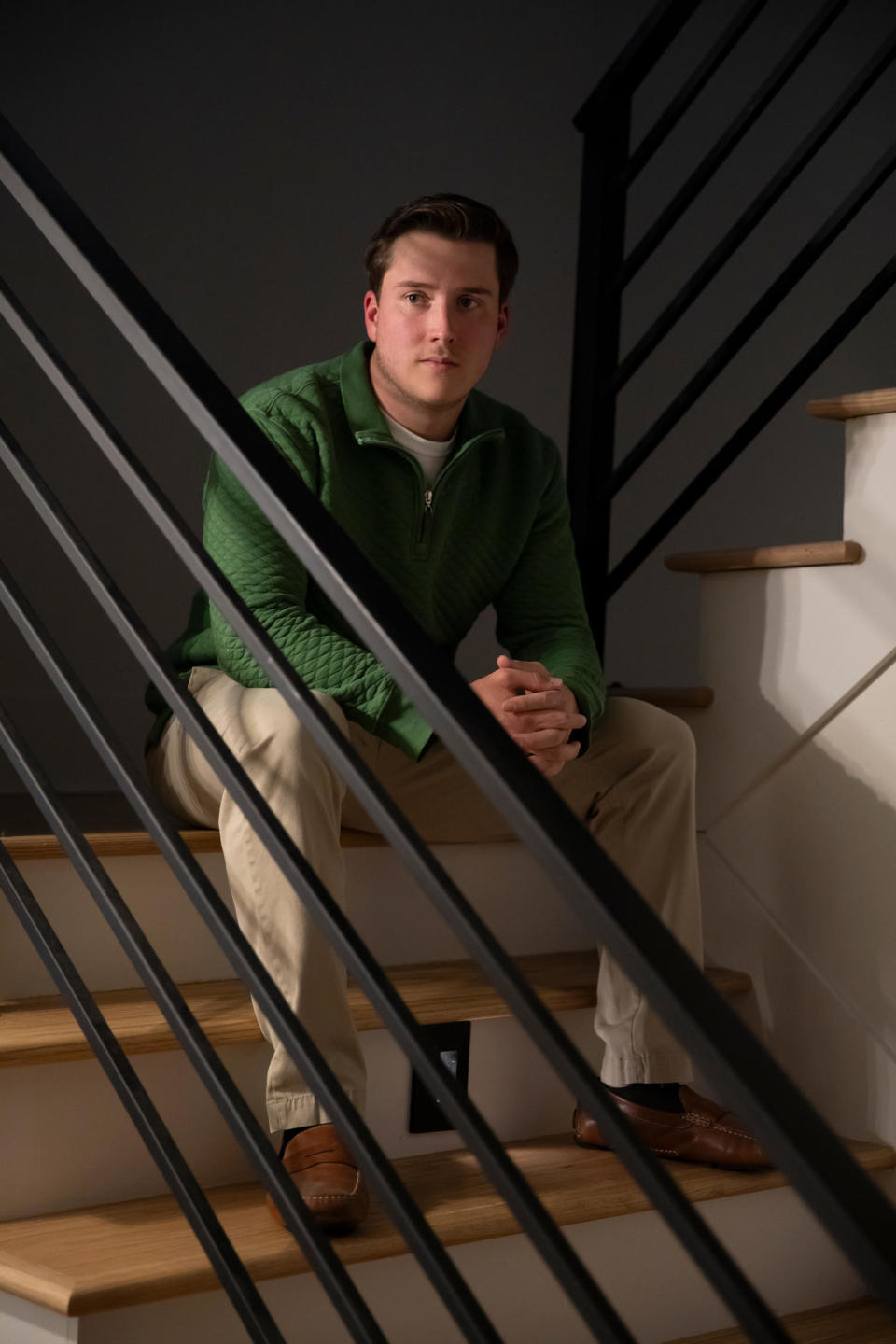 Jace Curry sits for a portrait on stairwell (Kendrick Brinson for NBC News)