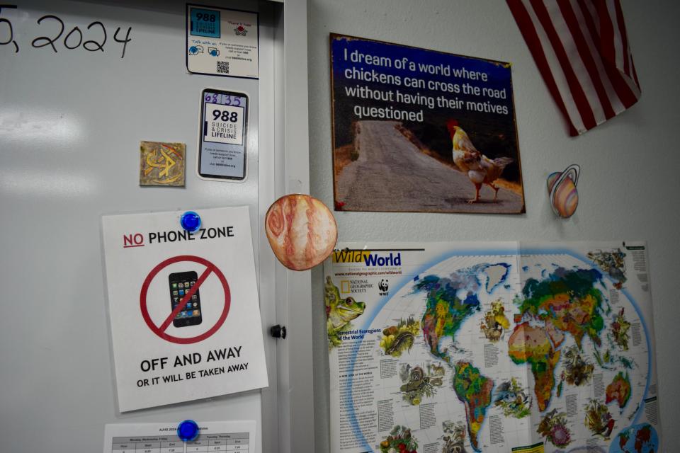 A "No Phone Zone" sign in science teacher Robert Walker's classroom at Apache Junction High School on Thursday July 25, 2024. The district adopted a new policy for the 2024-25 school year prohibiting cell phone use during class time.