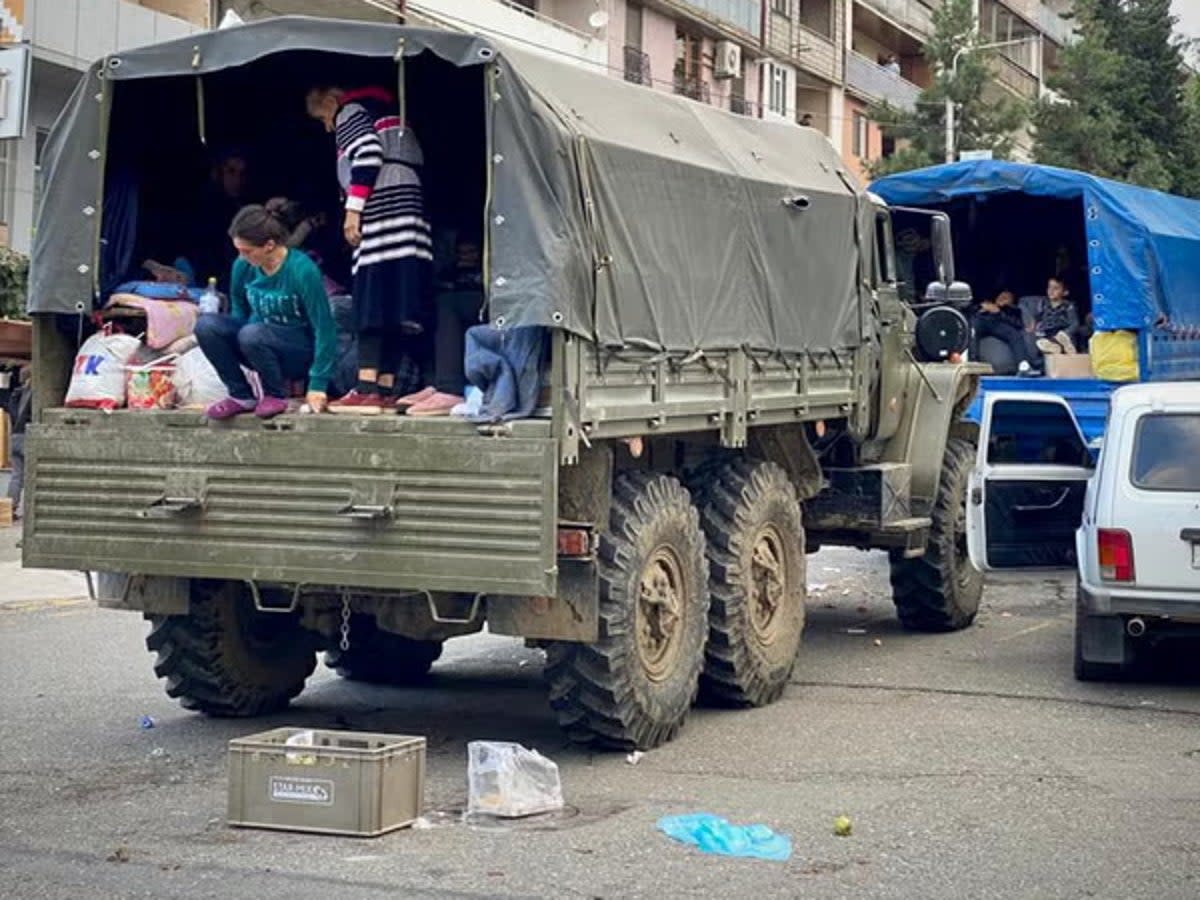 Families hitched lifts on the back of trucks as they fled Nagorno-Karabakh (Handout)