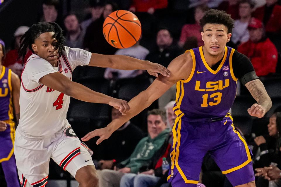 Jan 24, 2024; Athens, Georgia, USA; Georgia Bulldogs guard Silas Demary Jr. (4) and LSU Tigers forward Jalen Reed (13) go after a loose ball during the first half at Stegeman Coliseum. Mandatory Credit: Dale Zanine-USA TODAY Sports