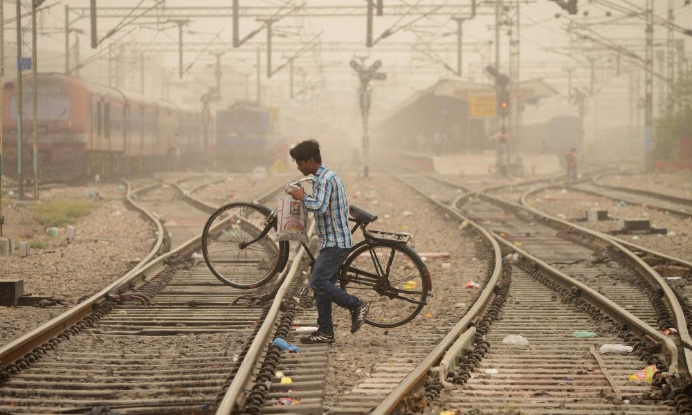 A commuter crosses railway tracks in Jalandhar, Punjab.