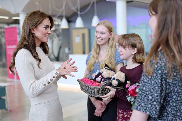 Kate was presented with teddy bears knitted by students (Chris Jackson/PA)