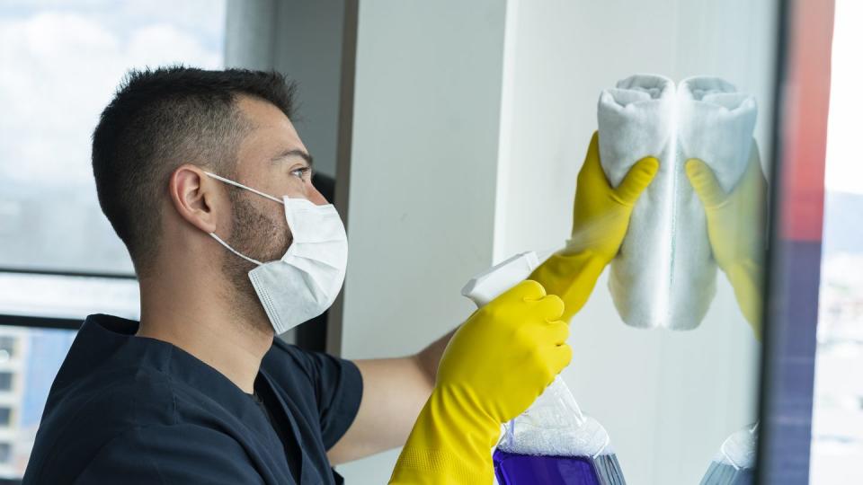 average 25 year old latino man cleans hotel rooms he works for