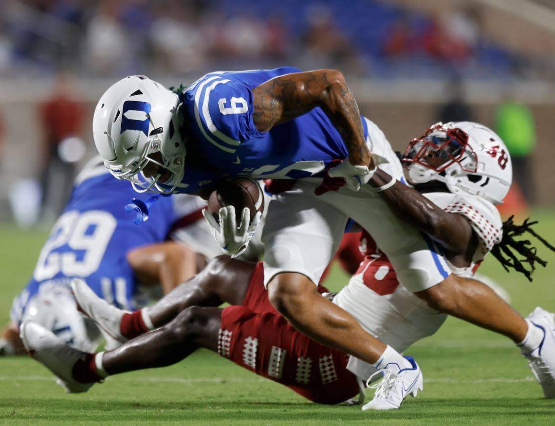 Duke wide receiver Eli Pancol (6) is brought down by Temple safety Jalen Ware (38) during the first half of the Blue Devils season opener at Wallace Wade Stadium on Friday, Sept. 2, 2022, in Durham, N.C.