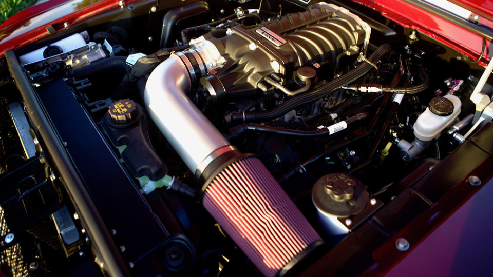 The supercharged, Rousch-tuned Ford 5.0-liter Coyote V-8 engine inside one of Revology's re-creations of the 1968 Shelby GT500 KR muscle car.