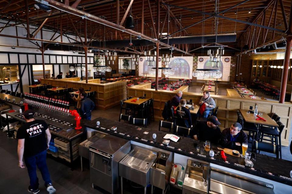 Patrons sit at the bar at Gilde Brewery in Charlotte.