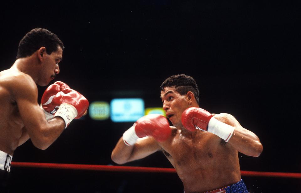 NEW YORK - JUNE 13,1986: Hector Camacho (R) looks to throw a punch to Edwin Rosario during the fight at Madison Square Garden in New York, New York. Hector Camacho won the WBC lightweight title by a SD 12.  (Photo by: The Ring Magazine via Getty Images) 