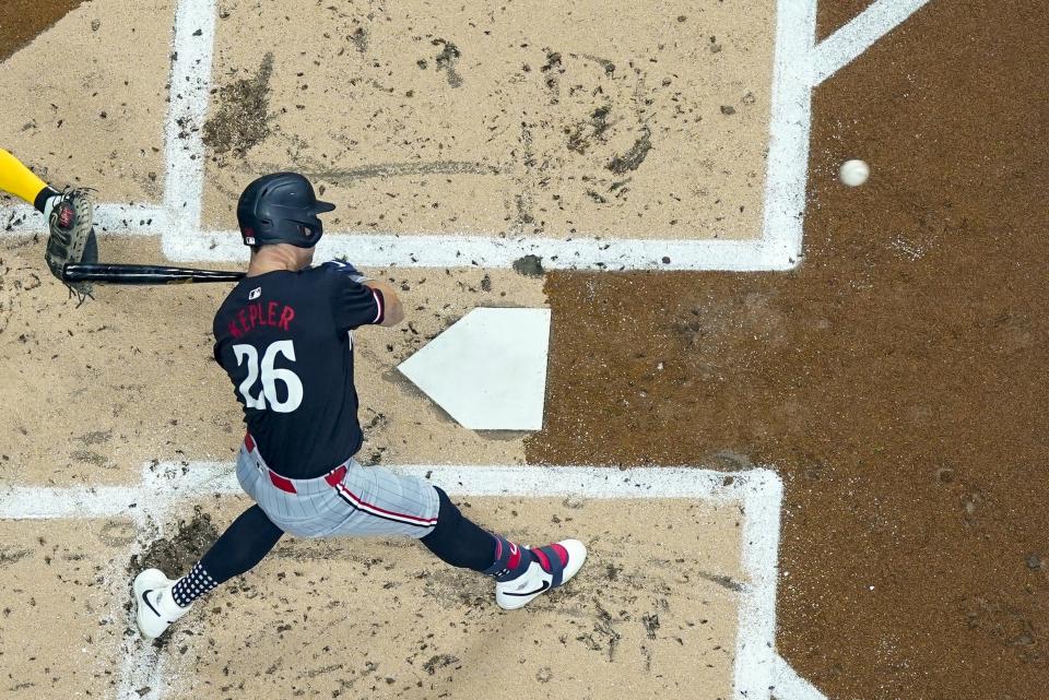 Minnesota Twins' Max Kepler hits a single during the second inning of a baseball game against the Milwaukee Brewers Tuesday, April 2, 2024, in Milwaukee. (AP Photo/Morry Gash)