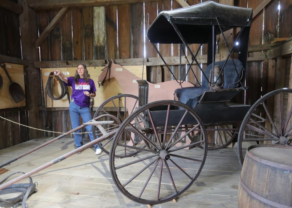 Kristie McMillen, a board member for the Brimfield Historical Society, gives a tour of the 1840s Boszor Family Barn. It is part of the Kelso House Museum tour.