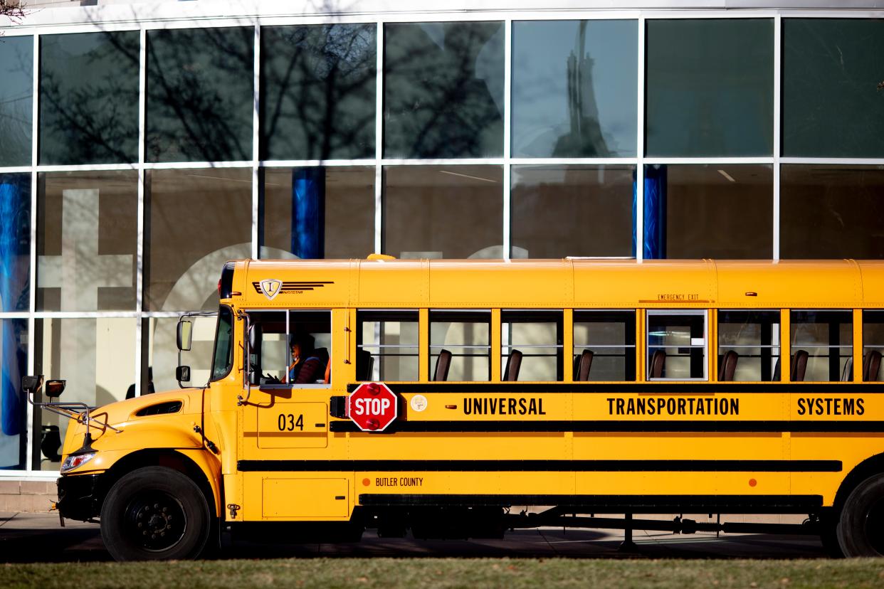 School buses line up to take children home on Tuesday, Jan. 11, 2022, outside of Cincinnati Public School's School for Creative and Performing Arts in Cincinnati.