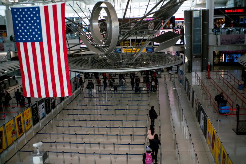 People walk through lines to reach TSA immigration process at the John F. Kennedy International Airport in New York