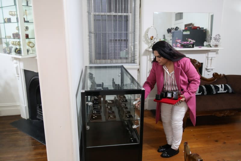 A jewellery designer attends to her shop amidst the easing of the coronavirus disease (COVID-19) restrictions, in Sydney