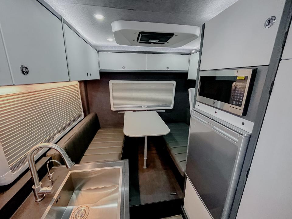 inside the inside the RexRover with a kitchen, dinette with a kitchen, dinette