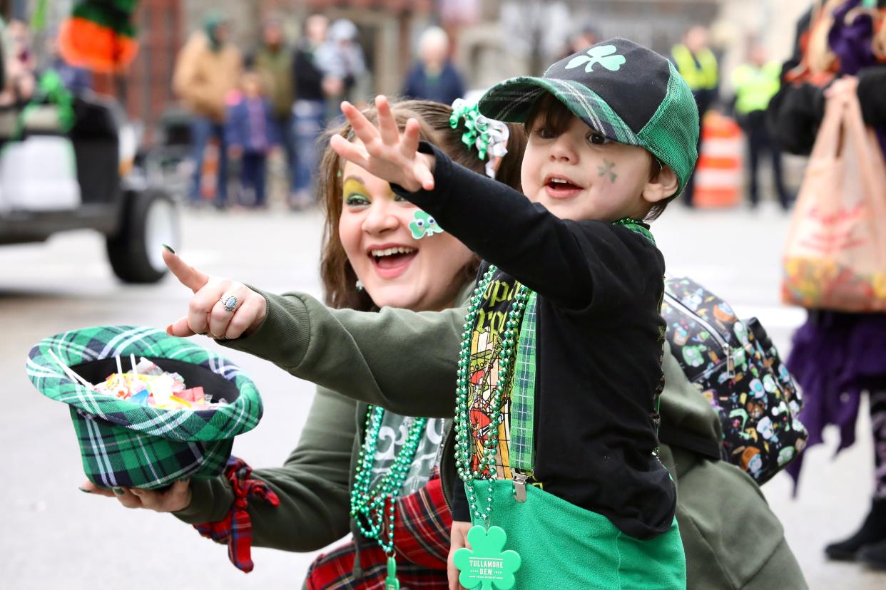 Spectators watch as Rockford's St. Patrick's Day Parade makes its way down East State Street on Saturday, March 19, 2022.