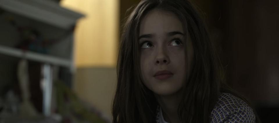 Claire in her bedroom in "The Gray Man"