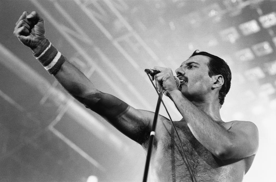 Rock group Queen in concert at Wembley Arena. Lead singer Freddie Mercury performing on stage on his 38th birthday. 5th September 1984. (Photo by Nigel Wright/Mirrorpix/Getty Images)