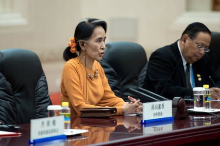 Myanmar State Counsellor Aung San Suu Kyi (L) talks with Chinese Premier Li Keqiang (not pictured) during a meeting at the Great Hall of the People in Beijing, China May 16, 2017. REUTERS/Nicolas Asfouri/Pool