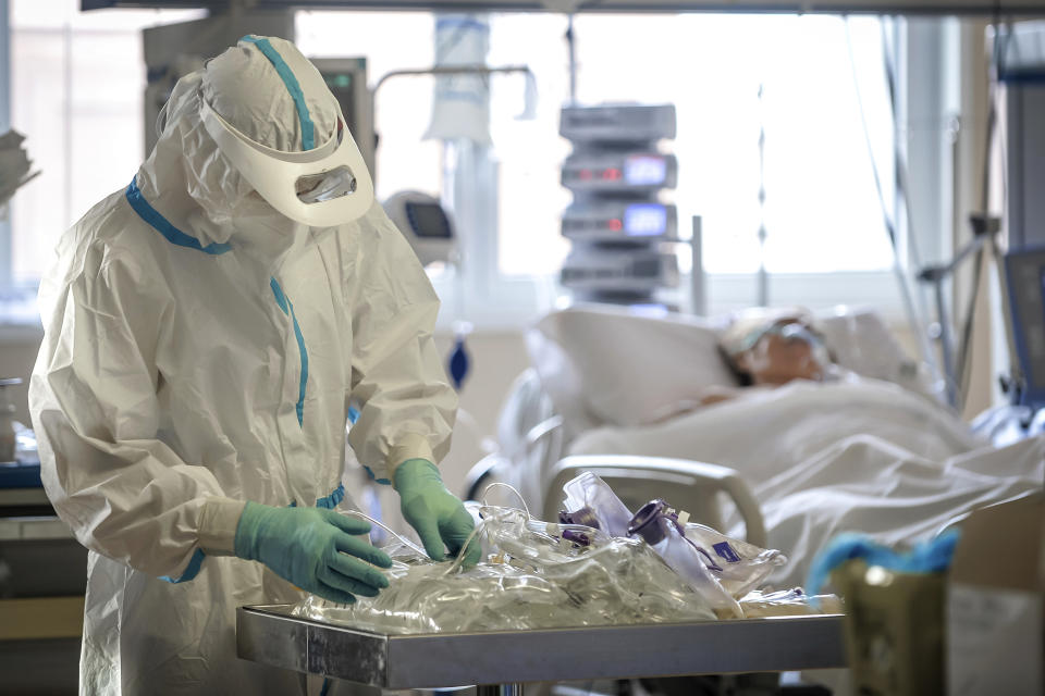 Medical staff tend to patients in the intensive care unit of the Circolo Hospital and Macchi Foundation of Varese, Italy, Friday, Oct. 30, 2020. Italy on Friday added more than 31,000 confirmed new cases of COVID-19 since the previous day, the highest one-day new caseload for the country in the pandemic. “The epidemic is galloping” in Italy, said Gianni Rezza, a top Health Ministry official. (Claudio Furlan/LaPresse via AP)