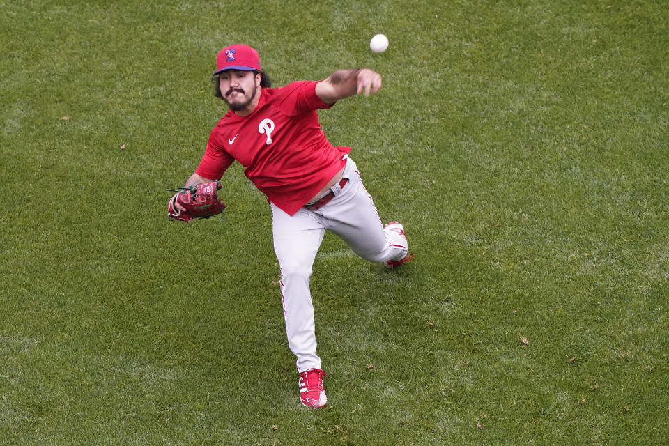 Philadelphia Phillies starting pitcher JoJo Romero throws in the outfield at Citi Field after a baseball game against the New York Mets was postponed due to rainy weather, Monday, April 12, 2021, in New York. (AP Photo/Kathy Willens)