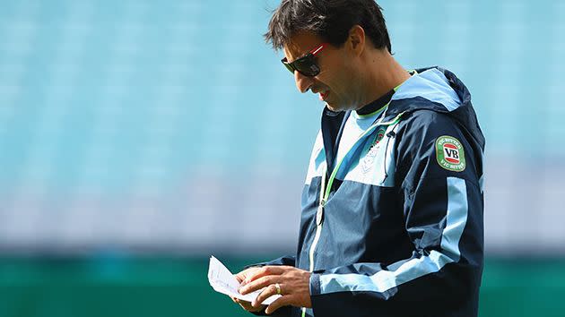 Blues coach Laurie Daley with a set of notes at training. Image: Getty