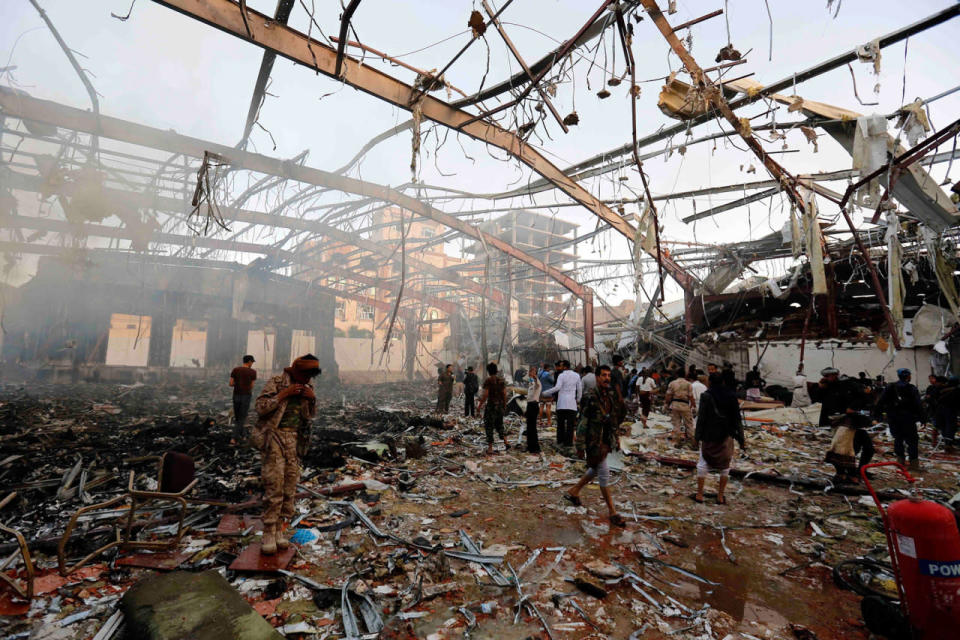 <p>People inspect the aftermath of a Saudi-led coalition airstrike in Sanaa, Yemen, Saturday, Oct. 8, 2016. (AP Photo/Osamah Abdulrhman)</p>