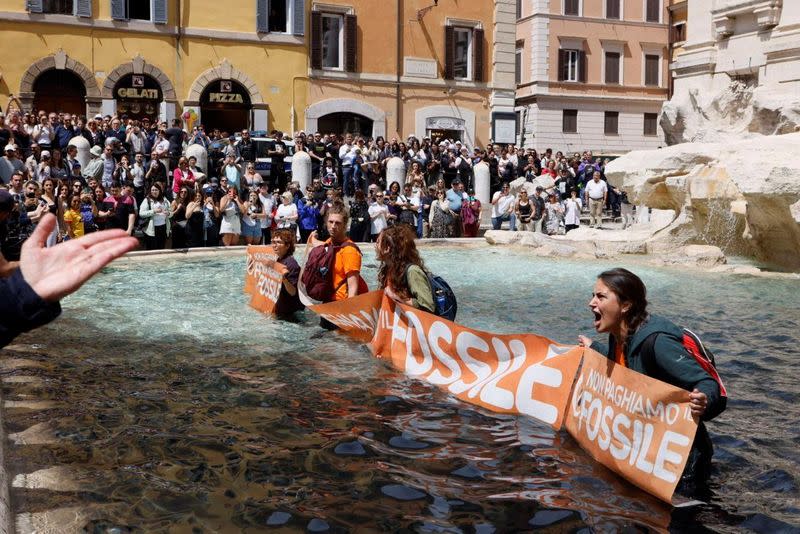 Climate activists protest at Trevi Fountain, Rome