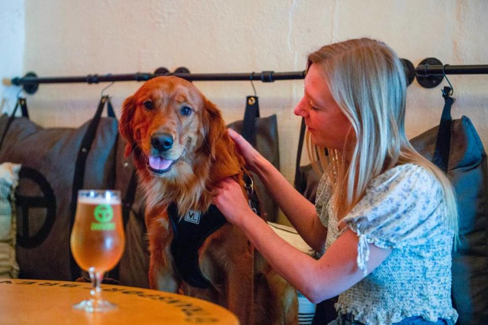 As part of her job covering restaurant and retail news, reporter Jenna Thompson brought her dog, Winston, to the pet-friendly Transport Brewery in Shawnee.
