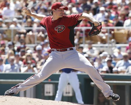 FILE PHOTO: Arizona Diamondbacks pitcher Daniel Hudson delivers a pitch during their MLB spring training game against the Los Angeles Dodgers in Glendale, Arizona April 1, 2012. REUTERS/Darryl Webb
