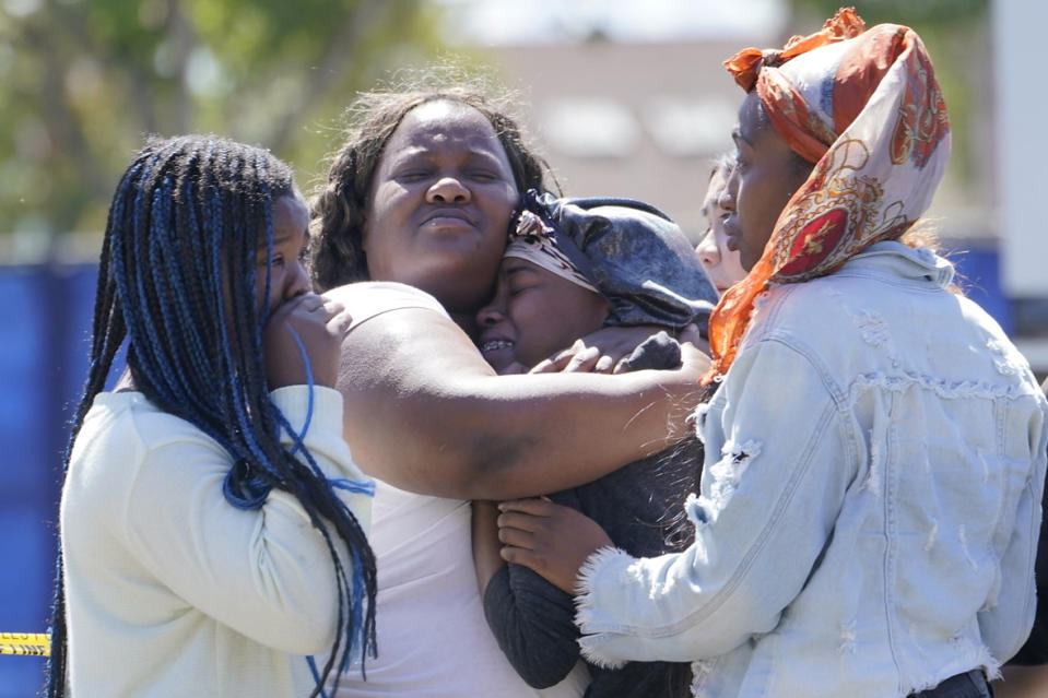 FILE - People react as Los Angeles County Medical Examiner-Coroner remove a body from a crime scene in Beverly Hills, Calif., Friday, Jun. 25, 2021. Homicides in California rose again last year,as did other violent crime, amid rising frustration as the state's top Democrats are seeking to keep their jobs in upcoming elections. (AP Photo/Damian Dovarganes, File)