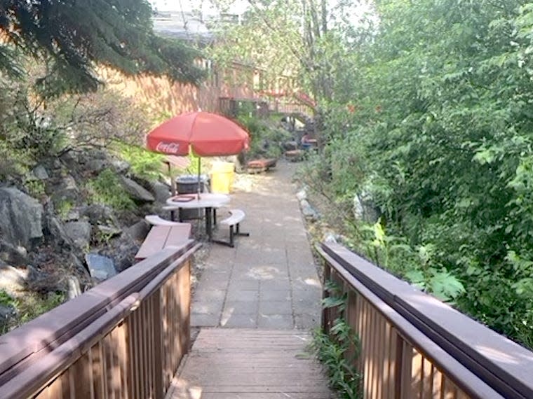 View of ramp leading down to outdoor seating area of arctic roadrunner in alaska