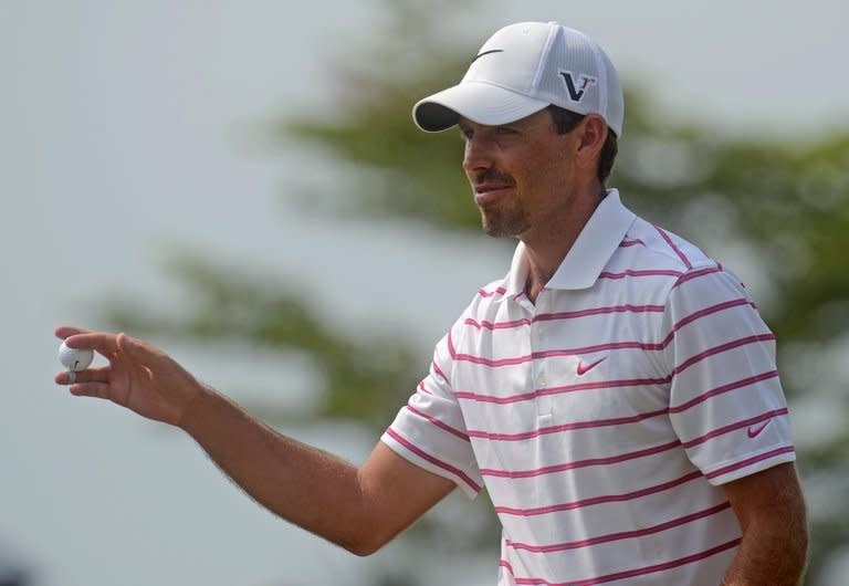 Charl Schwartzel of South Africa acknowledges the crowd after a putt during the Thailand Golf Championship, in Chonburi province, on December 9, 2012. Former US Masters champion starts as favourite to win a third Joburg Open title in four seasons this week