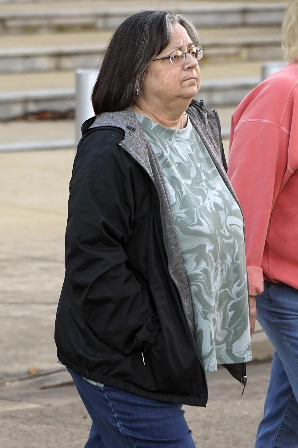 Wanda Farris, the mother of slain teenager Leesa Gray, leaves the federal courthouse in Jackson, Miss., on Monday, Nov. 28, 2022, after she and supporters listened to several hours of arguments about Mississippi's three-drug protocol for executions. Thomas Edwin Loden Jr. pleaded guilty in 2001 to capital murder, rape and four counts of sexual battery in the 2000 death of Gray, a 16-year-old waitress from north Mississippi. Loden is a plaintiff in the lawsuit. The Mississippi Supreme Court has scheduled his execution for Dec. 14, 2022. (AP Photo/Rogelio V. Solis)