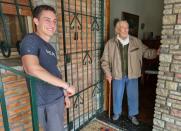 Hernan Mastrangelo, 100 year-old fan of Lionel Messi, writes down all of Messi's goals in his notebook, in Buenos Aires