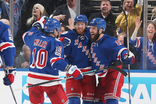 NEW YORK, NY - MAY 04: Oscar Lindberg #24, Tanner Glass #15 and J.T. Miller #10 of the New York Rangers celebrate after scoring a goal in the second period against the Ottawa Senators in Game Four of the Eastern Conference Second Round during the 2017 NHL Stanley Cup Playoffs at Madison Square Garden on May 4, 2017 in New York City. (Photo by Jared Silber/NHLI via Getty Images)