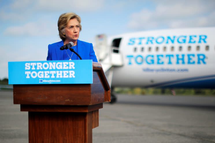 Hillary Clinton holds a news conference on the airport tarmac in front of her campaign plane. (Photo: Brian Snyder/Reuters)