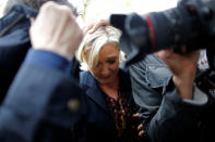 <p>Marine Le Pen, French National Front (FN) party candidate for 2017 presidential election, is protected by bodyguards as eggs are thrown by demonstrators during her arrival in Dol-de-Bretagne, France, May 4, 2017. (Photo: Stephane Mahe/Reuters) </p>