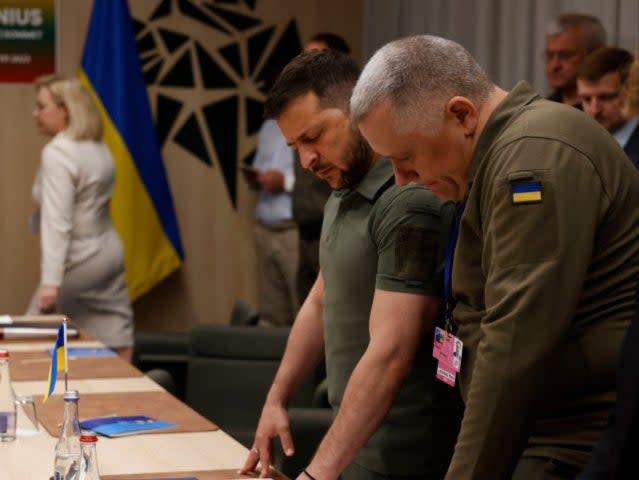 Ukrainian President Volodymyr Zelensky (2nd R) and the Deputy Head of the Office of the President of Ukraine Igor Zhovkva (R) are pictured during a bilateral meeting with the German Chancellor on the sidelines of the Nato Summit in Vilnius, Lithuania, last year (AFP via Getty Images)