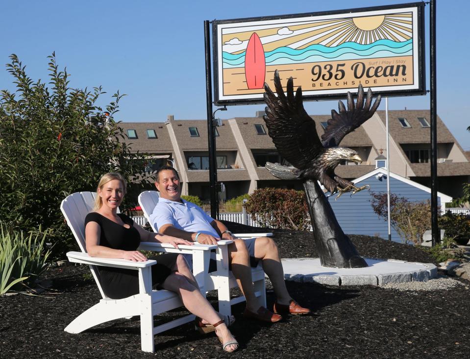 Owner Alex Choquette and general manager Christine Schindler sit outside the new 935 Ocean Beachside Inn in Hampton Oct. 4, 2023.