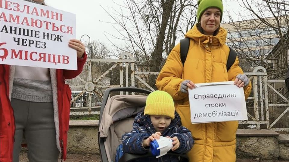 Antonina and her son Sasha, 3, take part in a protest in Kyiv, Ukraine, calling for soldiers' mobilization to have a time limit. - Daria Tarasova-Markina/CNN