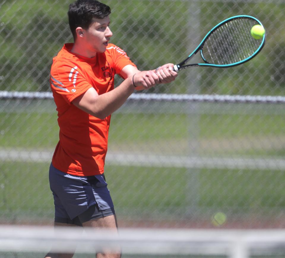 Ellet's Niko Vitor returns a serve by Kenmore-Garfield's Tyler Marr in the City Series Tennis Tournament on Monday at Hyre Park. Vitor finished as the runner-up in first singles.