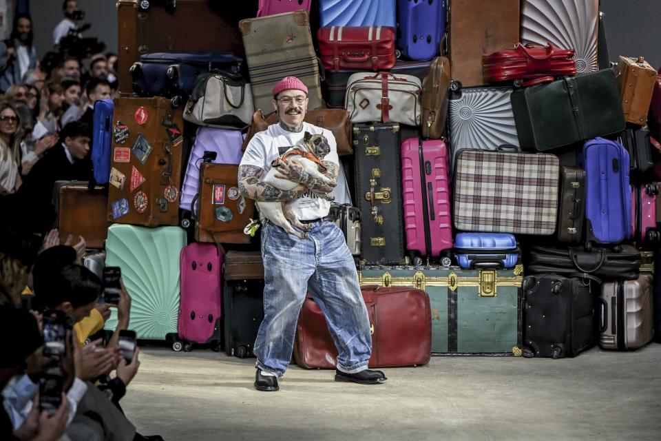 Creative director Adrian Appiolaza accepts applause at the end of the Moschino Spring Summer 2025 collection, that was presented in Milan, Italy, Friday, June 14, 2024. (AP Photo/Nicola Marfisi).