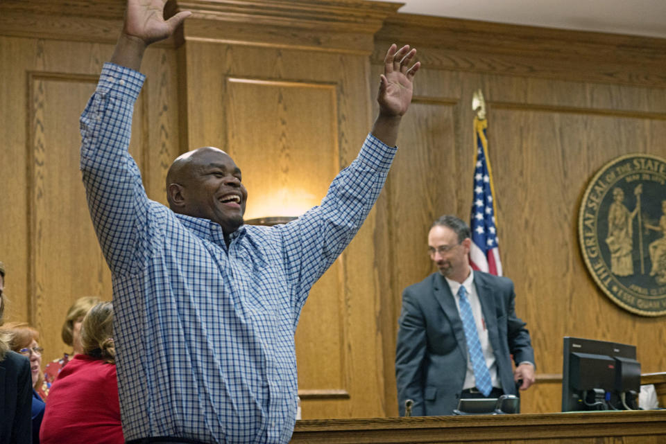 Dontae Sharpe enters a Pitt County courtroom to the cheers of his family after a judge determined he could be set free on a $100,000 unsecured bond on Thursday, Aug. 22, 2019 in Greenville, N.C. Sharpe, a North Carolina man who maintained his innocence even as he served a life sentence for a murder he didn’t commit said Thursday that he got his strength in prison from God and his mother. (Deborah Griffin/The Daily Reflector via AP)