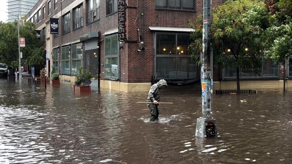 Flash flooding hit parts of the Northeast on Friday as heavy rainfall shattered records (The Independent)
