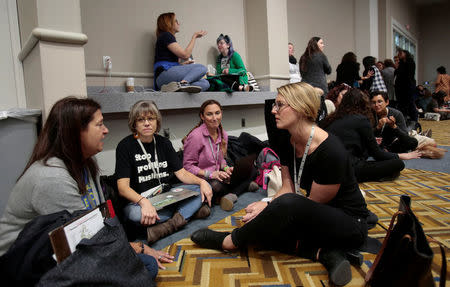 Attendees gather in break-out groups to talk about 'Confronting Anti-Semitism and White Supremacy' during, the three-day Women's Convention at Cobo Center in Detroit, Michigan, U.S., October 28, 2017. REUTERS/Rebecca Cook