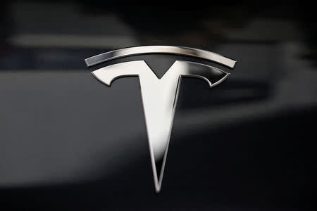 FILE PHOTO: A Tesla logo is seen in Los Angeles, California U.S. January 12, 2018. REUTERS/Lucy Nicholson