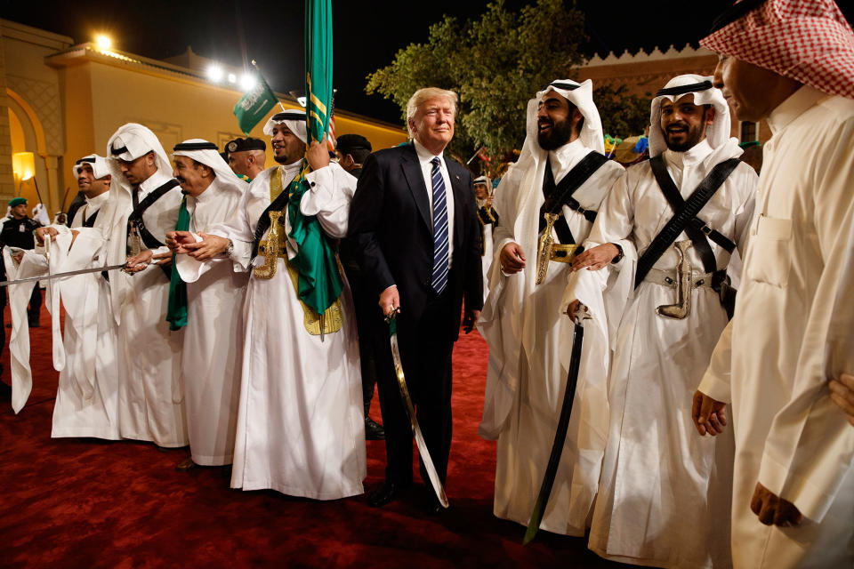 <p>President Donald Trump holds a sword and sways with traditional dancers during a welcome ceremony at Murabba Palace, Saturday, May 20, 2017, in Riyadh. (Photo: Evan Vucci/AP) </p>
