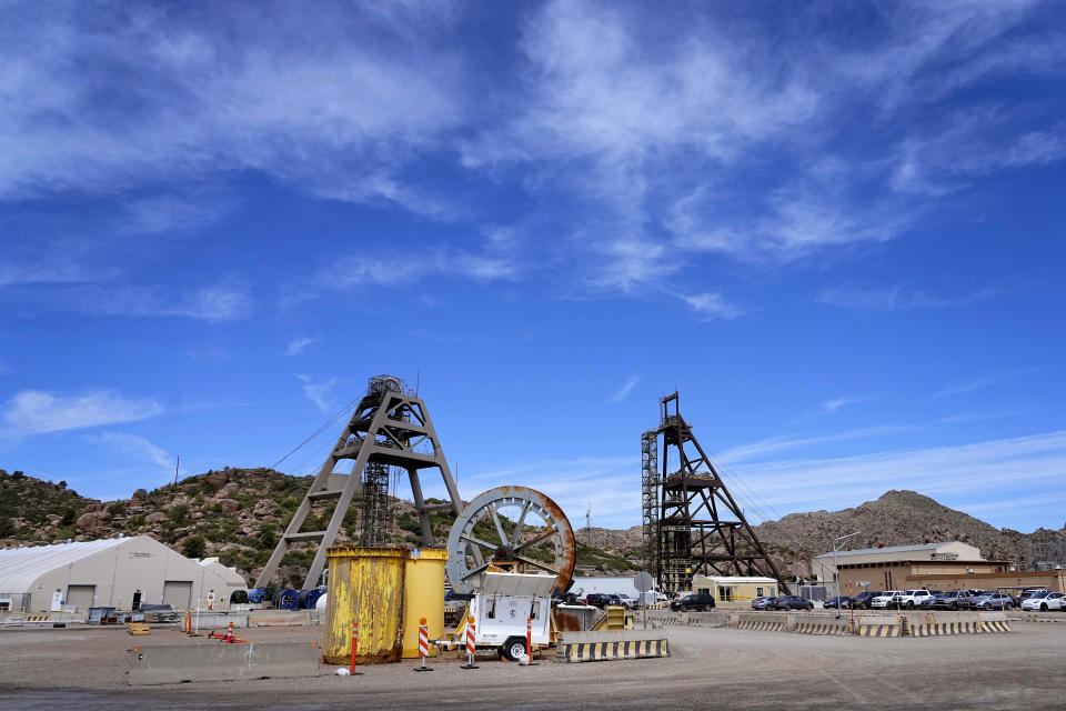 Mine shafts nine, right, and 10, left, tower over the Resolution Copper Mining Company facility, Friday, June 9, 2023, in Miami, Ariz. Resolution Copper Mining, a joint subsidiary of UK and Australian mining giants Rio Tinto and BHP, hopes to build one of the world's largest underground copper mines at Oak Flat outside Superior, about 70 miles (113 kilometers) east of Phoenix. (AP Photo/Matt York)